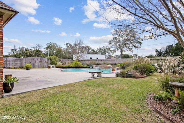 view of yard featuring a fenced in pool, a patio, and a fenced backyard