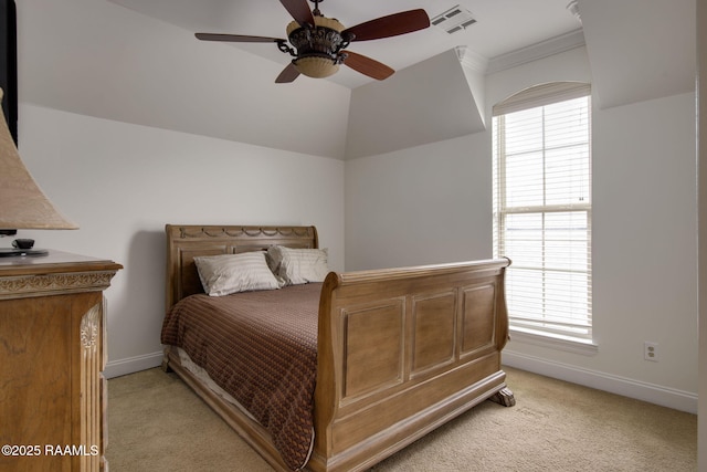 carpeted bedroom featuring ceiling fan and ornamental molding