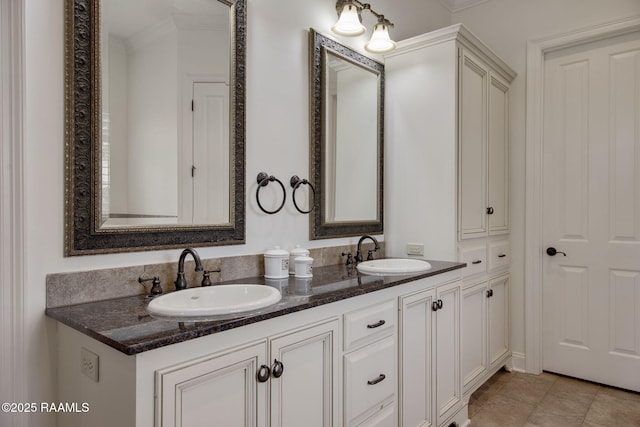 bathroom featuring vanity, tile patterned floors, and ornamental molding