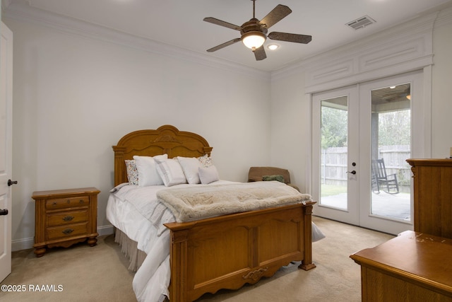 carpeted bedroom featuring access to exterior, french doors, ceiling fan, and crown molding