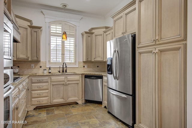 kitchen with tasteful backsplash, ornamental molding, stone tile floors, stainless steel appliances, and a sink