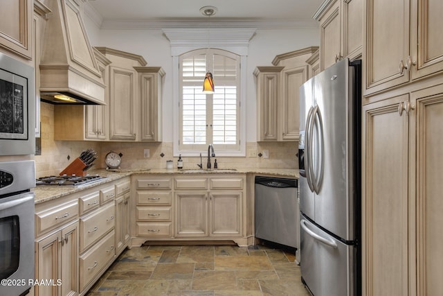 kitchen with custom exhaust hood, a sink, appliances with stainless steel finishes, crown molding, and tasteful backsplash