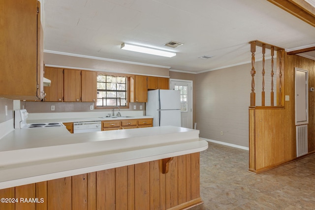 kitchen with kitchen peninsula, ornamental molding, white appliances, sink, and electric panel