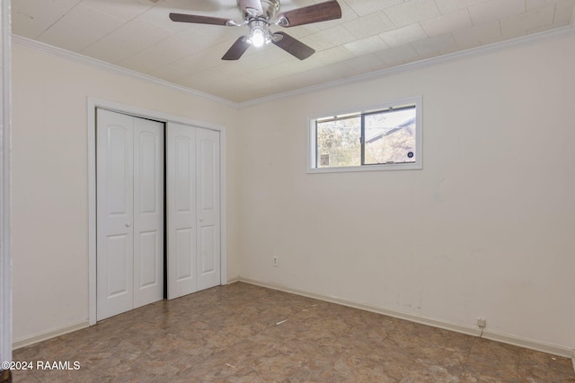 unfurnished bedroom with a closet, ceiling fan, and crown molding