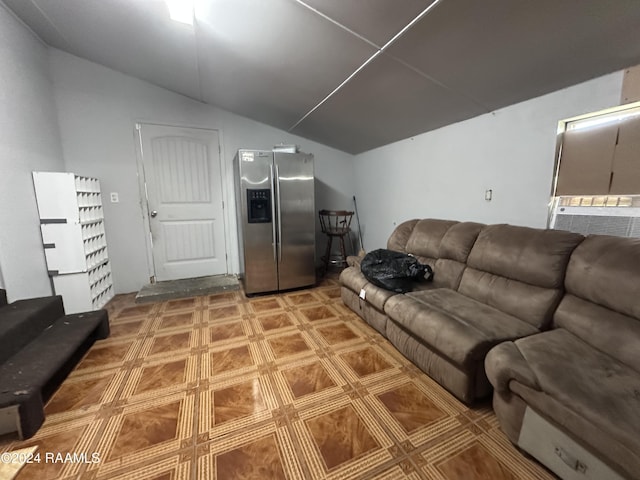 living room featuring vaulted ceiling and cooling unit