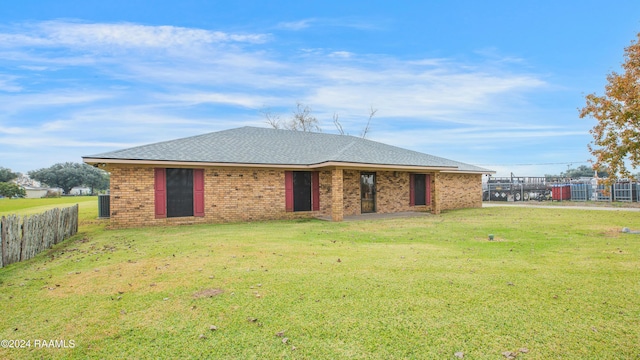 back of house with a yard