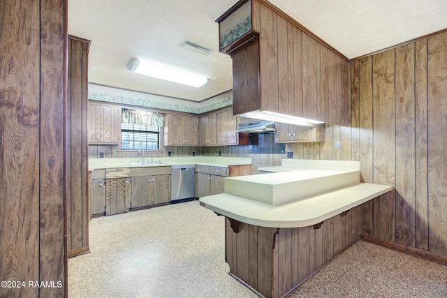 kitchen featuring dishwasher, a kitchen breakfast bar, sink, range hood, and kitchen peninsula