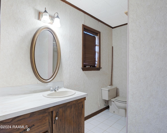 bathroom featuring tile patterned floors, vanity, toilet, and ornamental molding