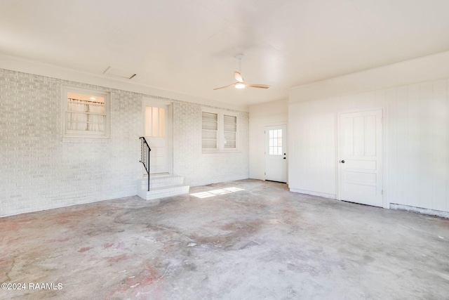 interior space featuring ceiling fan