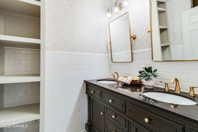 bathroom featuring vanity and tile walls