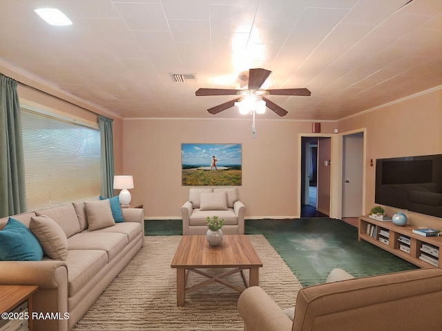 living room featuring a ceiling fan, carpet, visible vents, and crown molding