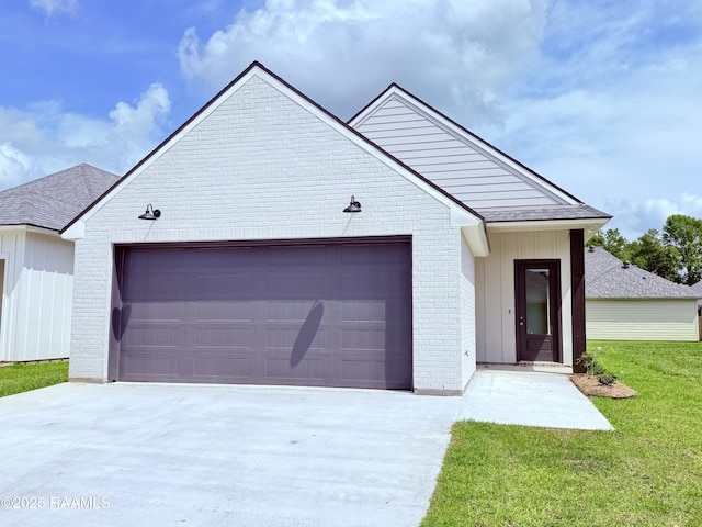 213 Berchman Oaks Dr, Lafayette, LA 70506 - view of front of home featuring an attached garage, brick siding, a front yard, and concrete driveway