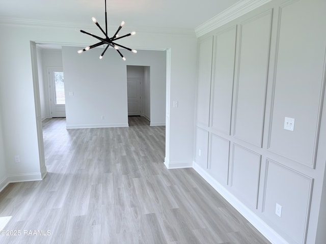 213 Berchman Oaks Dr, Lafayette, LA 70506 - interior space with light wood-style flooring, baseboards, an inviting chandelier, and ornamental molding