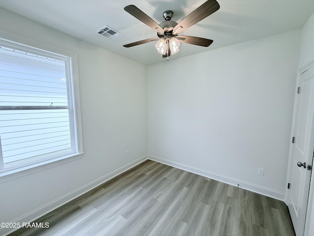 213 Berchman Oaks Dr, Lafayette, LA 70506 - spare room featuring ceiling fan, baseboards, visible vents, and light wood-style flooring