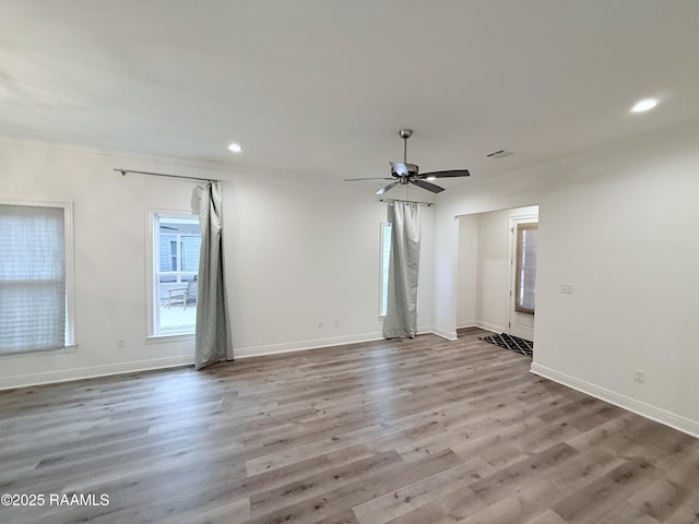 unfurnished room featuring light hardwood / wood-style floors and ceiling fan