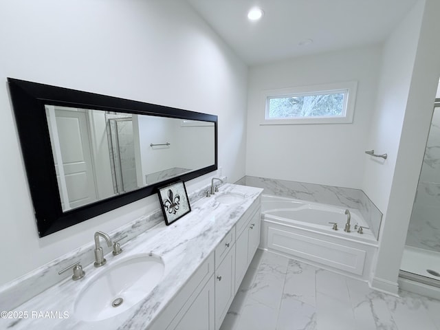 bathroom featuring vanity and separate shower and tub