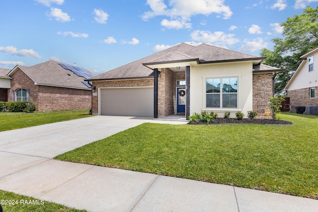 view of front facade featuring a garage and a front lawn