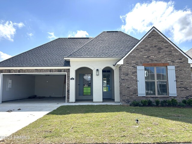 108 Fillmore Way, Lafayette, LA 70506 - view of front of home featuring a garage, a shingled roof, driveway, brick siding, and a front lawn