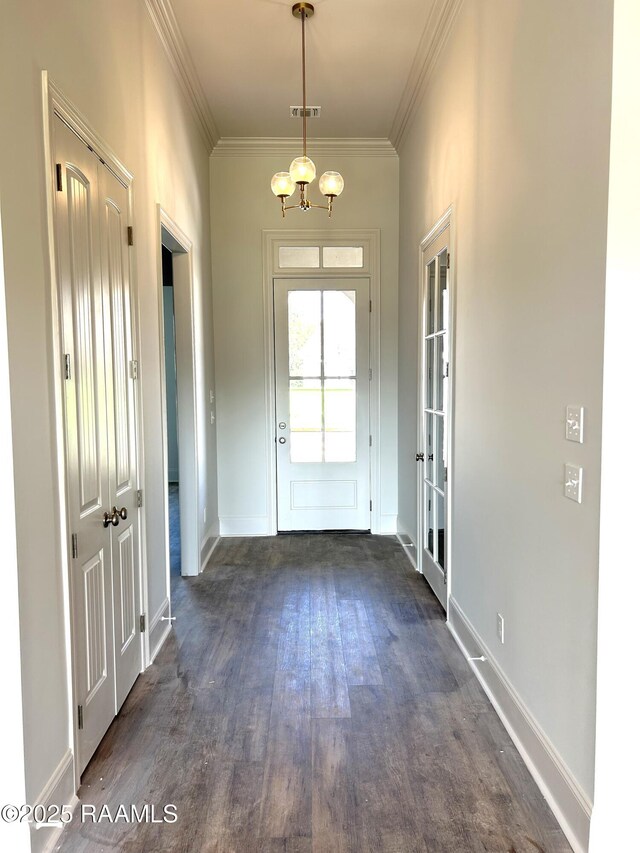 108 Fillmore Way, Lafayette, LA 70506 - entryway with dark wood-style flooring, ornamental molding, baseboards, french doors, and a chandelier