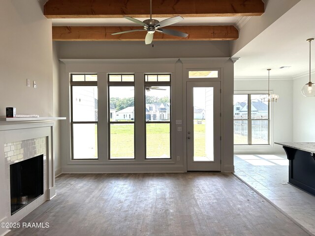 108 Fillmore Way, Lafayette, LA 70506 - unfurnished living room featuring a ceiling fan, beam ceiling, ornamental molding, a fireplace, and wood finished floors