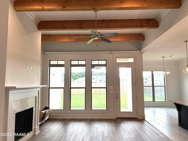 108 Fillmore Way, Lafayette, LA 70506 - entryway featuring beam ceiling, a fireplace, crown molding, wood finished floors, and a ceiling fan