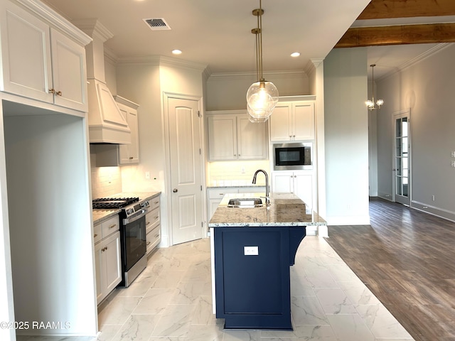 108 Fillmore Way, Lafayette, LA 70506 - kitchen with stainless steel gas range oven, built in microwave, recessed lighting, white cabinetry, and light stone counters