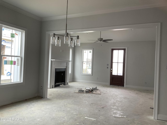 unfurnished living room featuring crown molding and ceiling fan