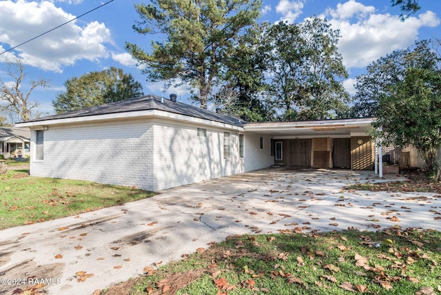 view of front of property with a carport