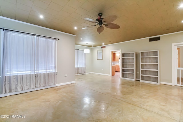 spare room with ceiling fan and ornamental molding