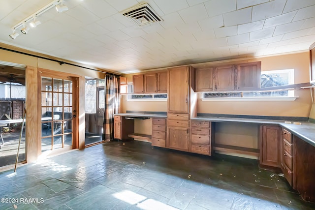 kitchen featuring rail lighting