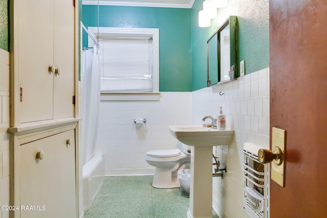 bathroom with toilet, tile walls, and shower / tub combo with curtain