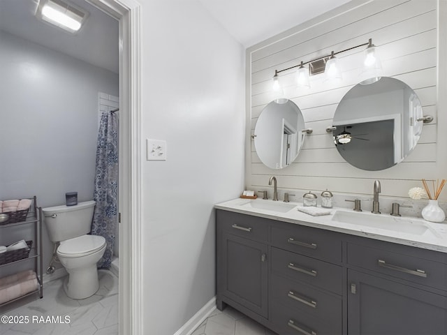 bathroom with toilet, walk in shower, and vanity