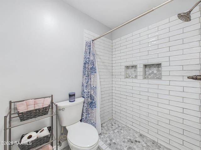 bathroom with toilet and curtained shower