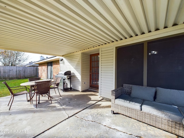 view of patio with an outdoor living space and a grill