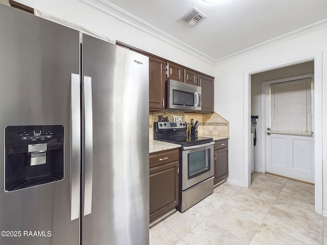 kitchen featuring light stone countertops, crown molding, stainless steel appliances, decorative backsplash, and dark brown cabinets