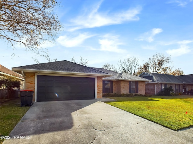 ranch-style home with a front lawn and a garage