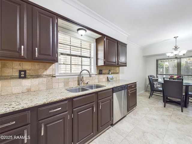 kitchen featuring tasteful backsplash, stainless steel dishwasher, sink, hanging light fixtures, and ornamental molding