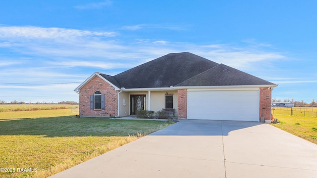 view of front of property featuring a garage and a front lawn