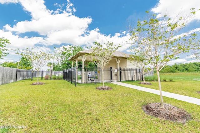 view of front of house with a gazebo, a front lawn, and fence