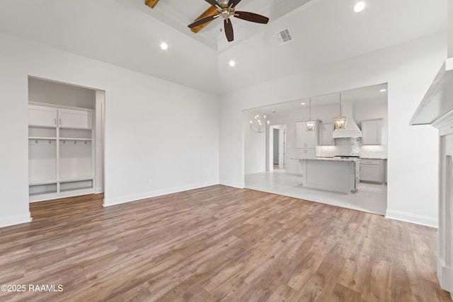 102 Fillmore Way, Lafayette, LA 70506 - unfurnished living room featuring ceiling fan, light wood-style floors, recessed lighting, high vaulted ceiling, and beam ceiling