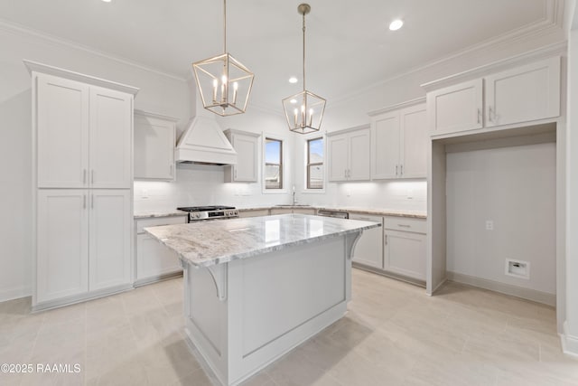 102 Fillmore Way, Lafayette, LA 70506 - kitchen with tasteful backsplash, a kitchen island, a chandelier, light stone countertops, and crown molding
