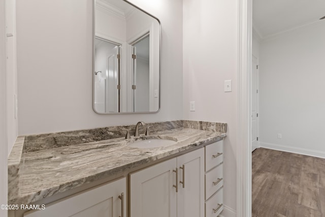 102 Fillmore Way, Lafayette, LA 70506 - bathroom with ornamental molding, vanity, and wood finished floors