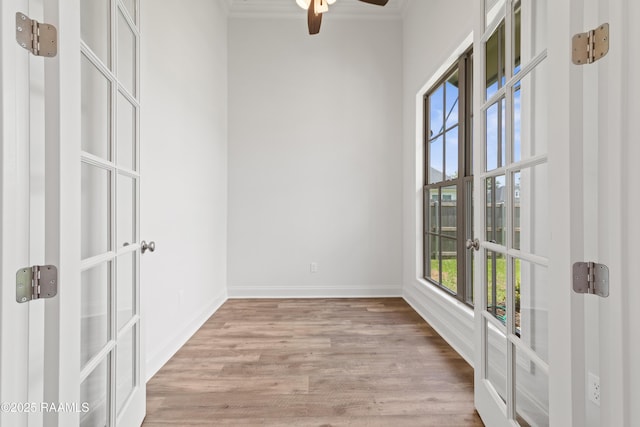 102 Fillmore Way, Lafayette, LA 70506 - unfurnished room featuring crown molding, a ceiling fan, light wood-type flooring, and french doors