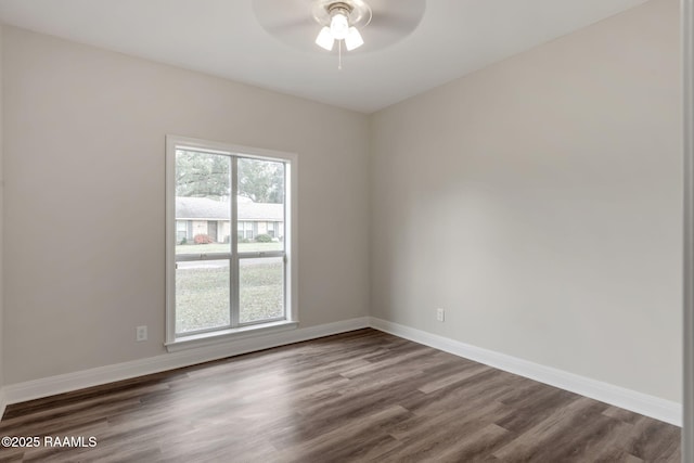 unfurnished room featuring ceiling fan and dark hardwood / wood-style floors