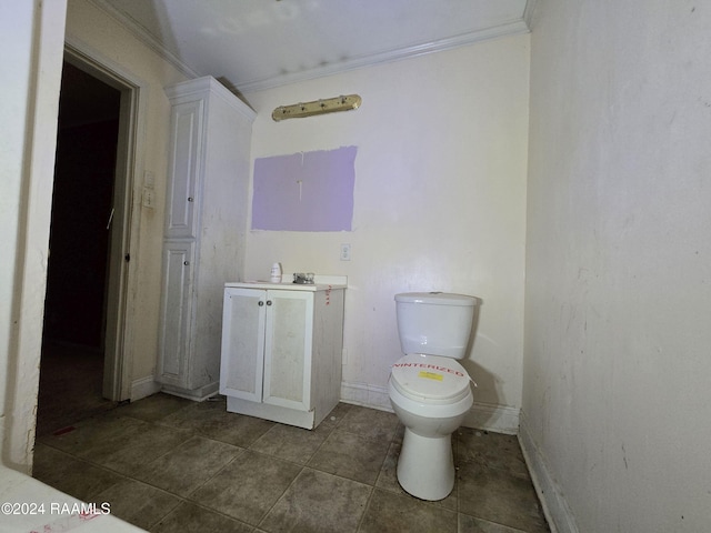 bathroom featuring toilet and ornamental molding