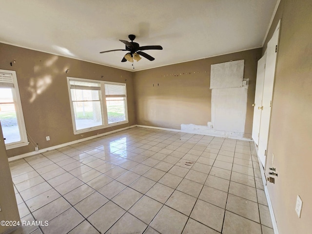 tiled empty room with ceiling fan