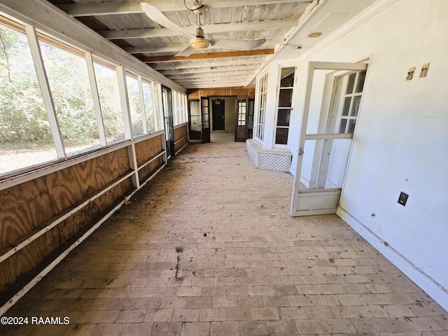 unfurnished sunroom with ceiling fan and wood ceiling