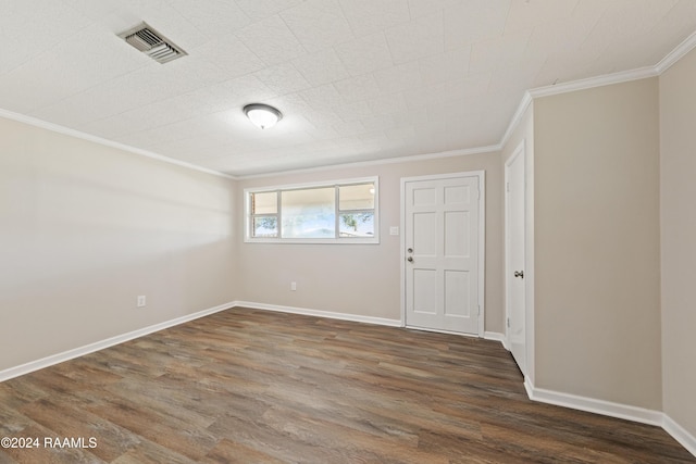 unfurnished room with dark hardwood / wood-style flooring and ornamental molding