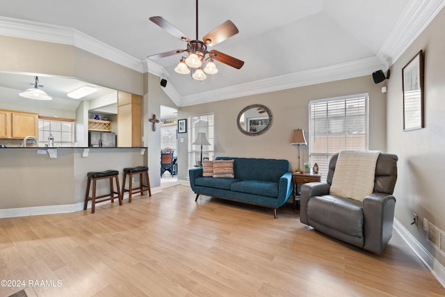 living room with ceiling fan, lofted ceiling, ornamental molding, and light hardwood / wood-style flooring