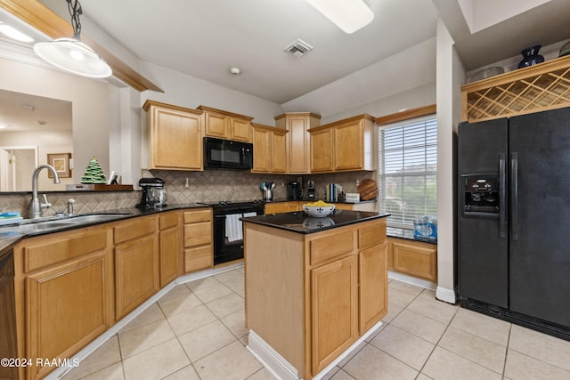 kitchen with tasteful backsplash, sink, black appliances, a center island, and hanging light fixtures